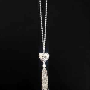 Kim rogers with a heart pendant and tassel